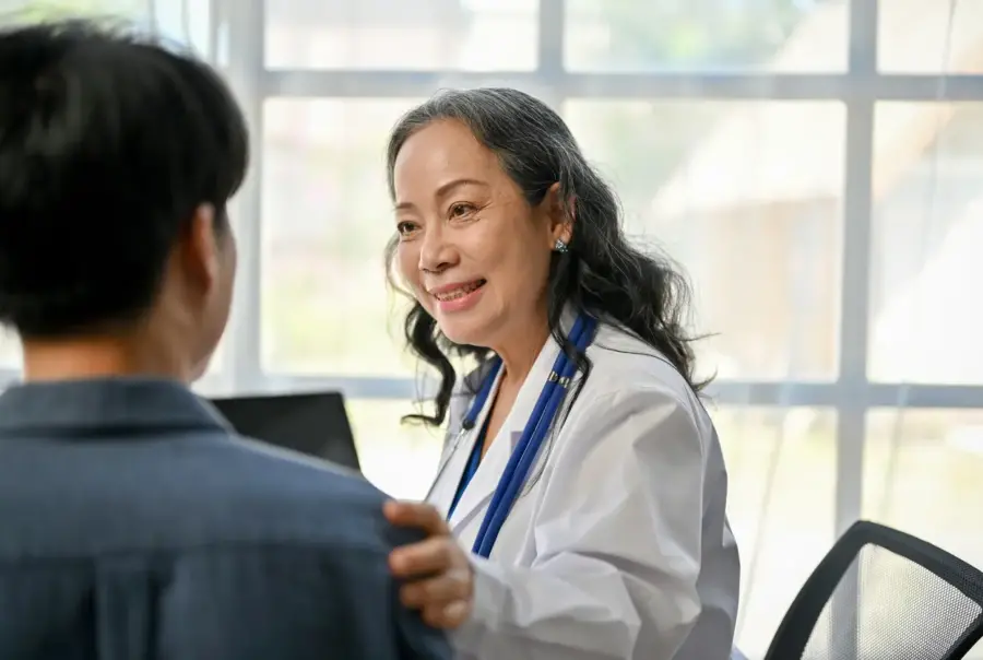 Smiling physician with patient